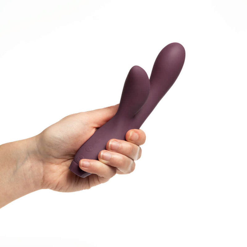 Je Joue Hera Rechargeable Silicone Rabbit Vibrator Purple held in hand for perspective.