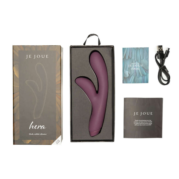 Je Joue Hera Rechargeable Silicone Rabbit Vibrator Purple in its packaging with accessories.