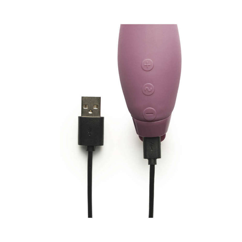 Je Joue Juno Rechargeable Silicone G-Spot Vibrator Purple charging with USB cable.
