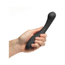 Je Joue Juno Flex Flexible Silicone G-Spot Vibrator Black held in hand, showcasing its sleek design and user-friendly controls.