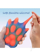 Alien Nation Pantera Glow in the Dark Clitoral Vibrator made of soft, flexible silicone, showcasing its claws and pads.