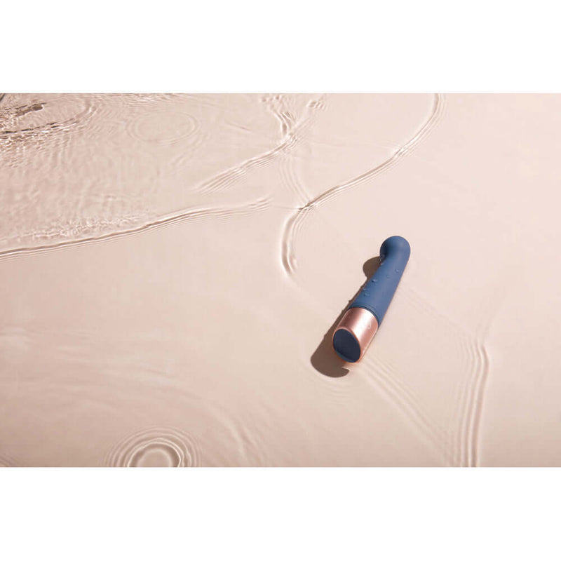 Deia The Couple G Spot and Bullet Massager Silicone Blue on a soft surface with water ripples.