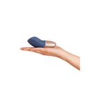 Deia The Arouser Pulsating External Stimulator Silicone Blue held in hand for scale and demonstration.