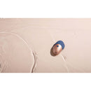 Deia The Arouser Pulsating External Stimulator Silicone Blue on a smooth surface, showcasing its sleek design and color.