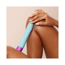 FemmeFunn Densa Bullet Dual Density Slimline Vibrator Light Blue resting on skin, showcasing elegant design and color.