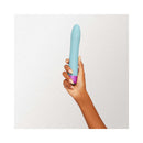 FemmeFunn Densa Bullet Dual Density Slimline Vibrator Light Blue held in hand with elegant design.