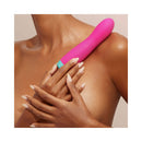 FemmeFunn Rora Rotating Bullet Vibrator Pink held by a model, showcasing its sleek design and vibrant color.