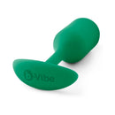 B-vibe Snug Plug 2 Weighted Silicone Anal Plug Green placed on a white background, showcasing its design.