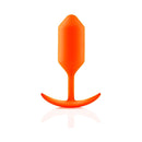 b-Vibe Snug Plug 3 Weighted Silicone Anal Plug Orange displayed on a reflective surface.