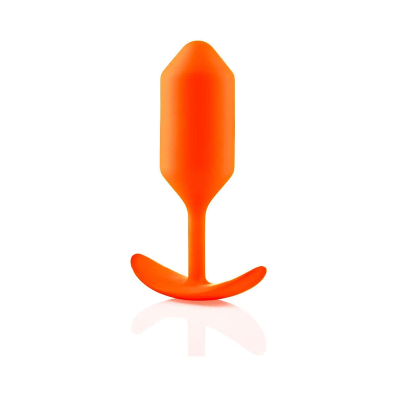 b-Vibe Snug Plug 3 Weighted Silicone Anal Plug Orange standing upright on a white background.
