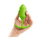 b-Vibe Snug Plug 3 Weighted Silicone Anal Plug Lime held in hand, showcasing its ergonomic design.