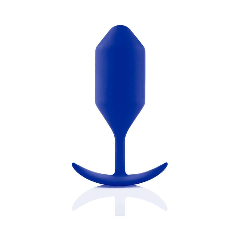b-Vibe Snug Plug 4 Weighted Silicone Anal Plug Navy displayed on a reflective surface