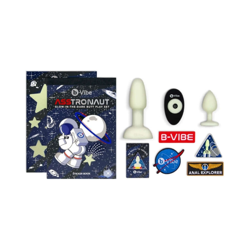 b Vibe 10 Piece Asstronaut Glow in the Dark Butt Play Set with plugs and stickers, including instruction book.