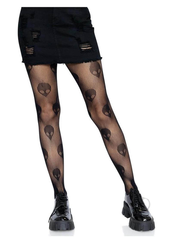Leg Avenue Alien Net Tights in black featuring alien skull designs, paired with a stylish distressed black skirt.
