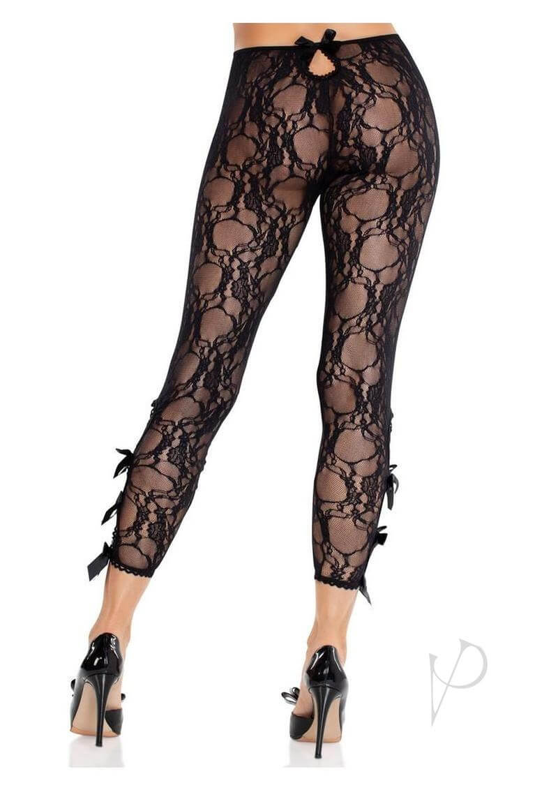 Black floral lace capri tights with scalloped trim and bow details on the ankles, showcasing a sensual silhouette.
