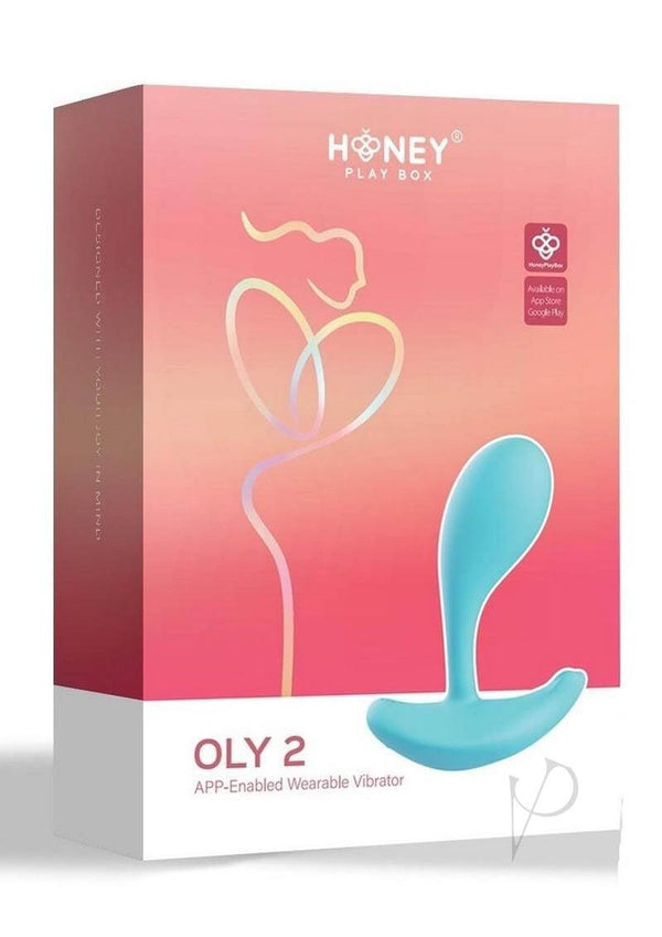 Oly 2 App Enabled Wearable Vibrator Blue by Honey Play Box packaging with a gradient pink background.