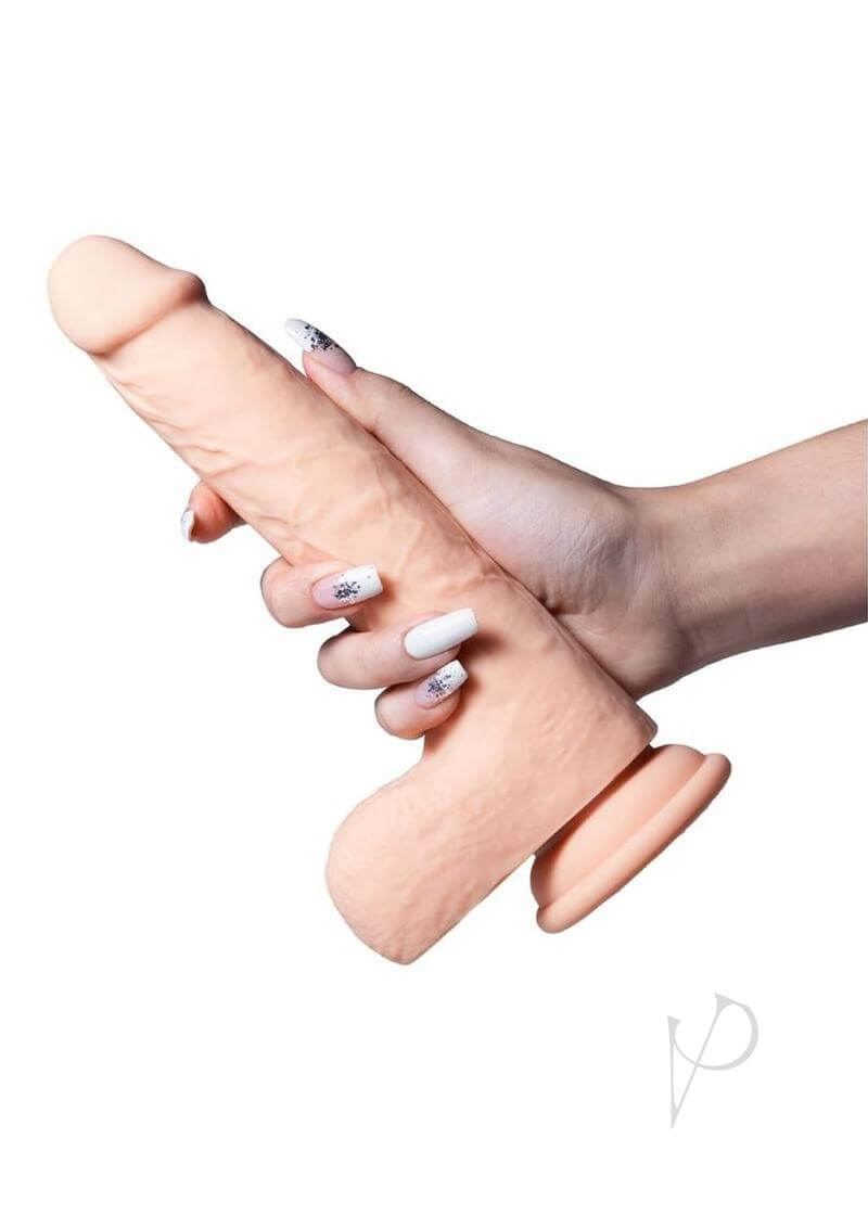 Luis App Controlled Thrusting Dildo 8.5 inches Tan held in hand, showcasing its realistic design and suction cup base.