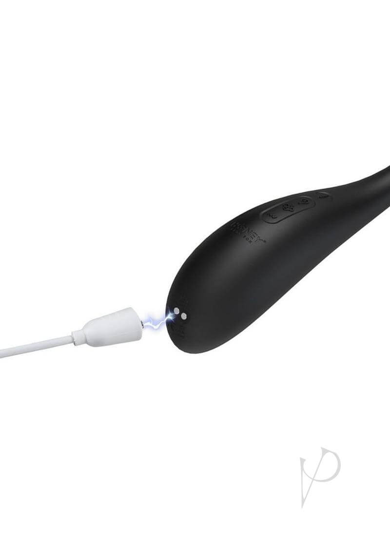 Puff Inflatable Kegel Ball Black by Honey Play Box charging with a white cable.