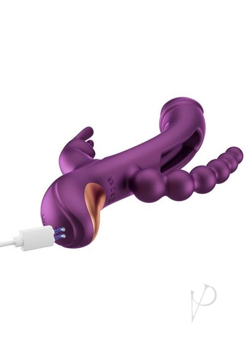 Trilux App Controlled Rabbit Vibrator Purple Honey Play Box charging with a USB cable, showcasing its unique design.