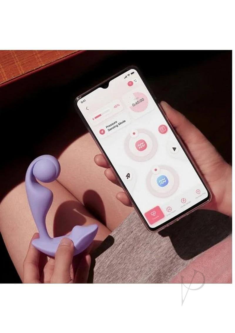 Trill Wearable Dual Vibrator Lavender by Honey Play Box next to a smartphone displaying its app controls.