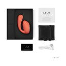 LELO IDA WAVE Rechargeable Dual Stimulator Coral Red in an elegant box with warranty card and charging cable.