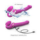 Strap-On-Me Multi Orgasm Strapless Strap-On Fuchsia XL with water splash, showcasing its waterproof feature.