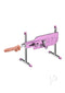 Kiiroo PleasureDrive Interactive Sex Machine Pink shown from the side with thrusting attachment.