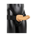 RealRock Realistic 6 Inch Hollow Strap-On Tan with adjustable harness on a mannequin.