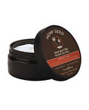 Earthly Body Hemp Seed Skin Butter 8 oz Jar Isle of You in a black jar with a thick cream inside.