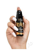 Orgie Dual Vibe Liquid Vibrator Gel Sex on the Beach in a hand showcasing its kissable design.