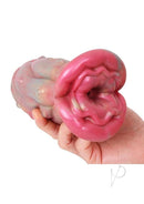 Monstar Cox Sucubut Stroker Fantasy Masturbator Pink held in hand with intricate design and seductive style.
