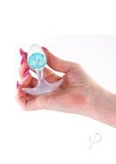 Glams Cosmic Silicone Anal Plug Small Clear Blue held in hand, showcasing its smooth design and sparkly blue accent.