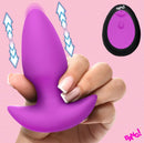 Bang Thrusting & Vibrating Silicone Butt Plug Purple in hand, showcasing thrusting and vibrating features.