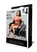 Image of WhipSmart Inflatable Bondage Chair Black featuring a model, built-in restraints, and a detachable vibrating dildo.
