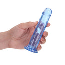 Realrock Crystal Clear 6 Inch Dildo Without Balls Blue held in hand, showcasing its translucent design and tapered head.