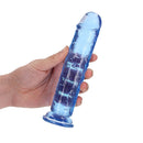Realrock Crystal Clear Straight 7 Inch Dildo Blue held in hand showcasing its translucent design.