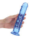 Realrock Crystal Clear Straight 8 Inch Dildo No Balls Blue held in hand, showcasing its smooth, translucent design.