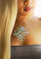 Celestial Body Jewels sticker applied on a woman's chest, enhancing beauty with sparkling gemstones and a radiant design.