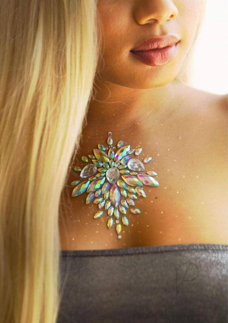 Celestial Body Jewels sticker applied on a woman's chest, enhancing beauty with sparkling gemstones and a radiant design.
