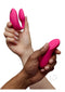 We Vibe Chorus Pro Couples Vibrator with Remote Control Pink held by two hands showcasing its design and functionality.