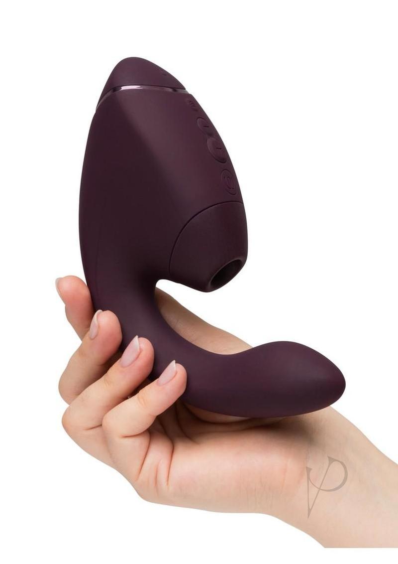 Womanizer Next Duo G-Spot and Clitoral Stimulator Purple held in hand, showcasing sleek design and features.