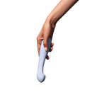 Dame Arc G-Spot Vibrator Ice being held, showcasing its elegant design and curved shape for pleasure exploration.
