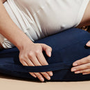 Person using the Dame Pillo Sex Pillow Indigo for enhanced comfort and pleasure during intimate moments.
