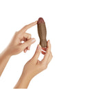 Shaft Bullet Rechargeable Realistic Silicone Mini Vibrator Oak held by hands, showcasing its realistic design and texture.