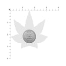 Quarter dollar coin centered on a background of a cannabis leaf silhouette.