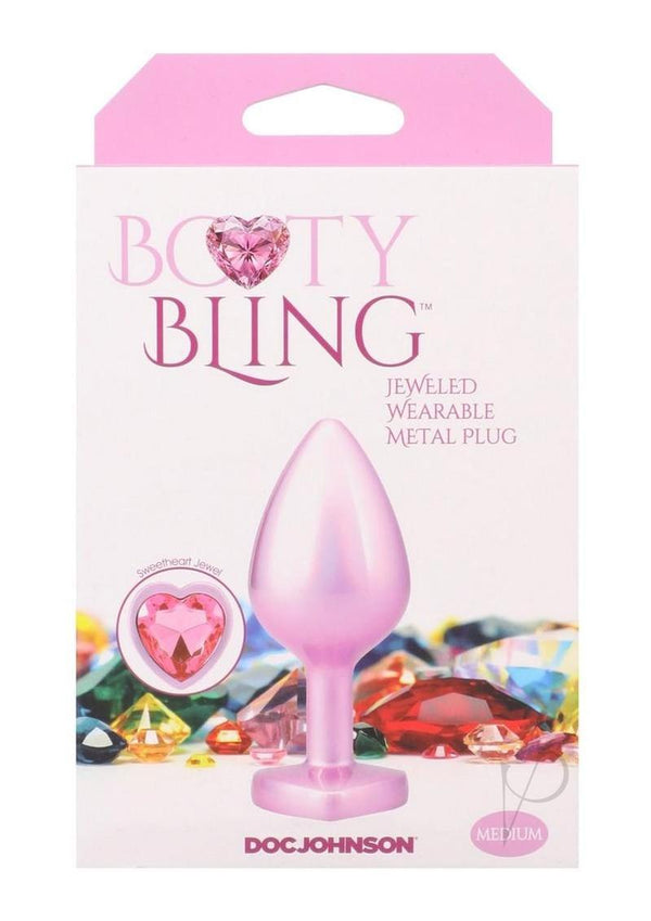 Booty Bling Heart Diamond Jeweled Wearable Metal Plug Medium Pink packaging featuring a pink metal plug and jeweled design.
