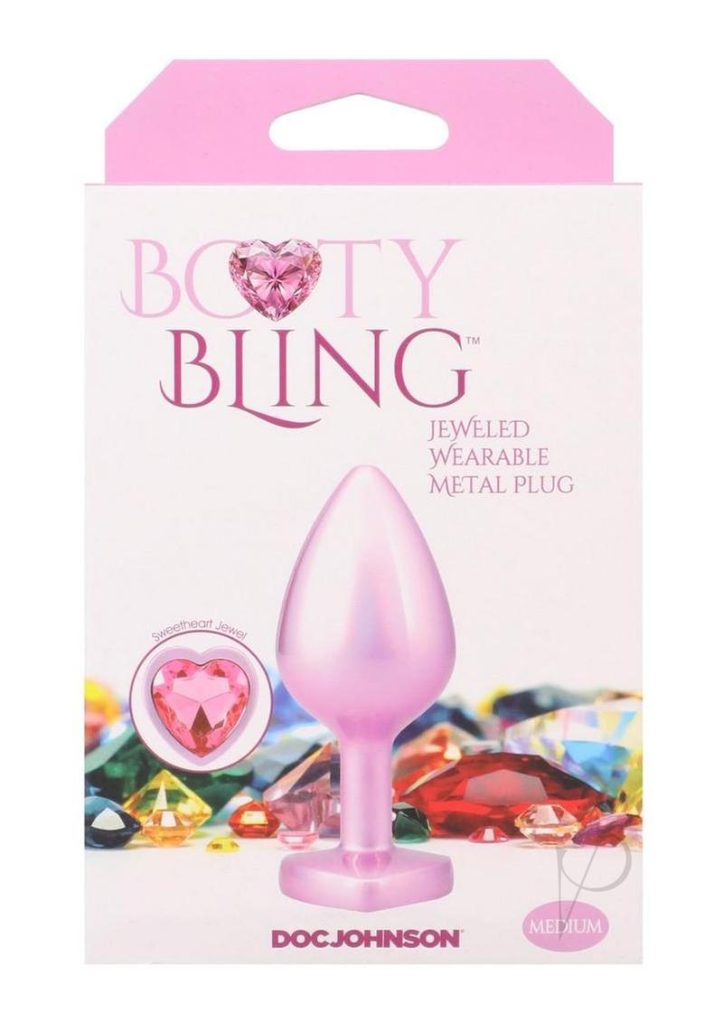 Booty Bling Heart Diamond Jeweled Wearable Metal Plug Medium Pink packaging featuring a pink metal plug and jeweled design.