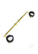 Lux Fetish Solid Gold Expandable Spreader Bar with Cuffs featuring a gold-tone bar and black leatherette cuffs.