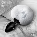 Tailz Fluffy Bunny Tail Silicone Plug White on a bed, showing its dimensions and plush design.