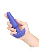 B-Vibe Shake Slimline Vibrating Silicone Anal Plug Blue held in hand, showcasing its slim design and vibrant color.